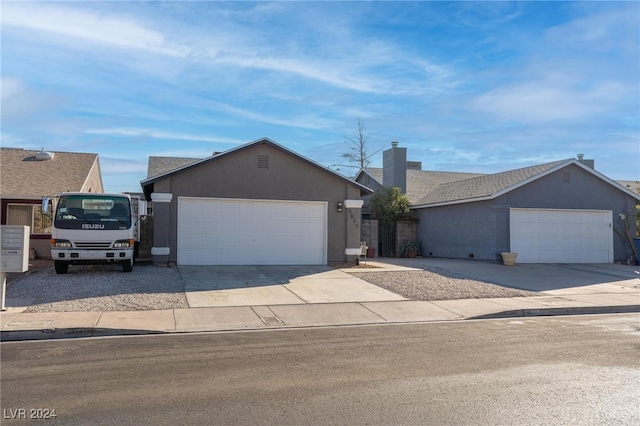 ranch-style home featuring a garage