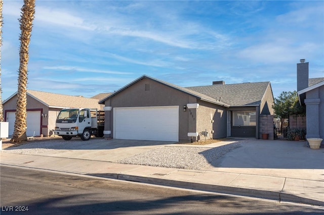 ranch-style home featuring a garage