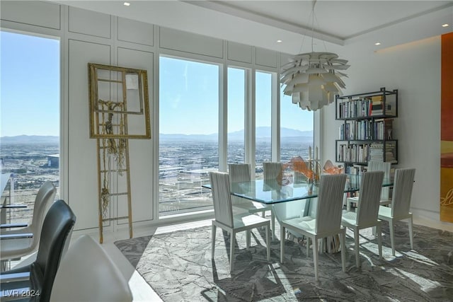 dining room featuring a mountain view