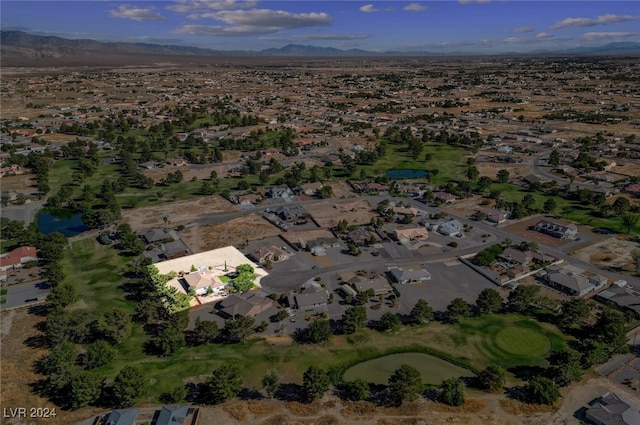 birds eye view of property featuring a water and mountain view