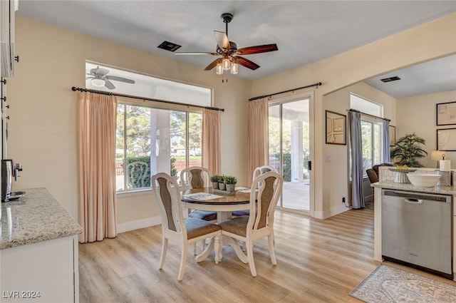 dining area with ceiling fan, plenty of natural light, and light wood-type flooring