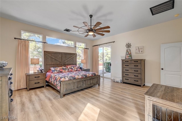 bedroom with ceiling fan, light wood-type flooring, and access to exterior