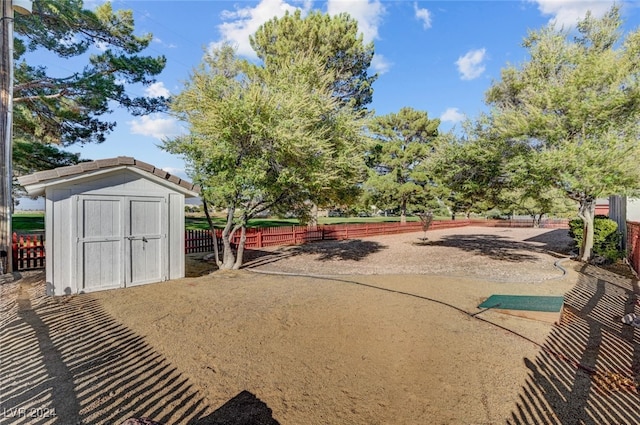 view of property's community with a storage shed