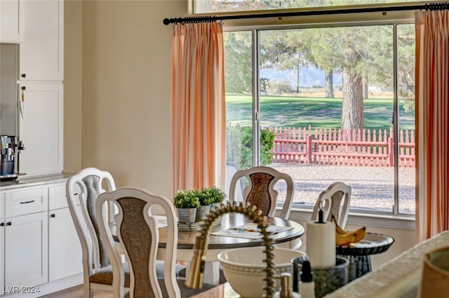 dining room featuring plenty of natural light