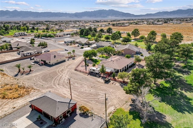 birds eye view of property featuring a mountain view