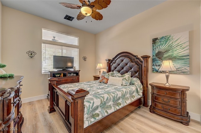 bedroom featuring light hardwood / wood-style floors and ceiling fan