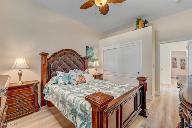 bedroom featuring a closet, light hardwood / wood-style floors, and ceiling fan