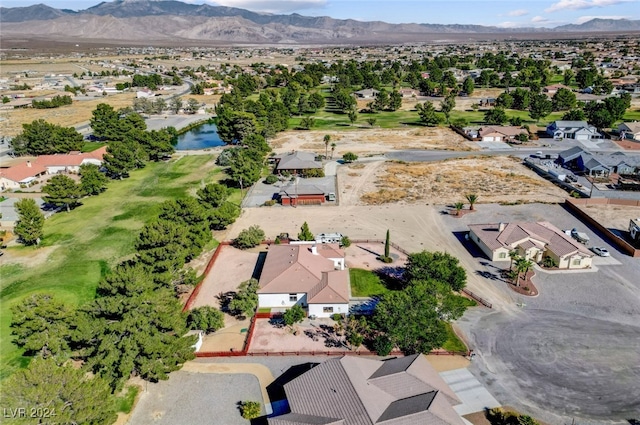 drone / aerial view featuring a water and mountain view