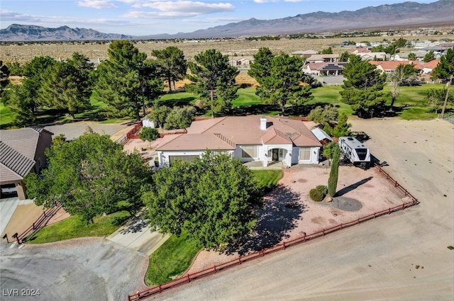 birds eye view of property with a mountain view