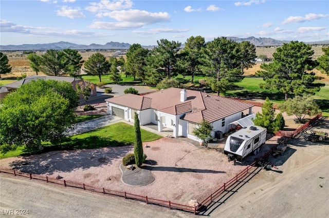 birds eye view of property featuring a mountain view