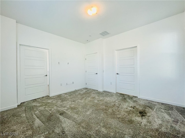 unfurnished bedroom with carpet floors