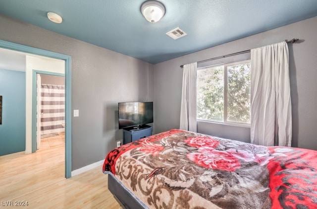 bedroom featuring light wood-type flooring