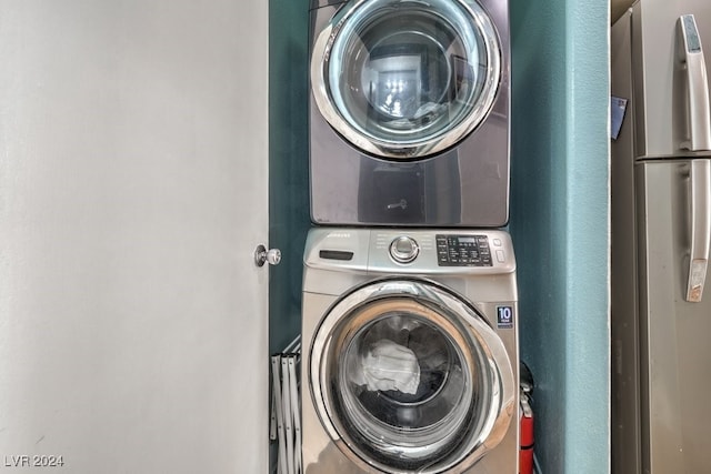 laundry room with stacked washer / dryer