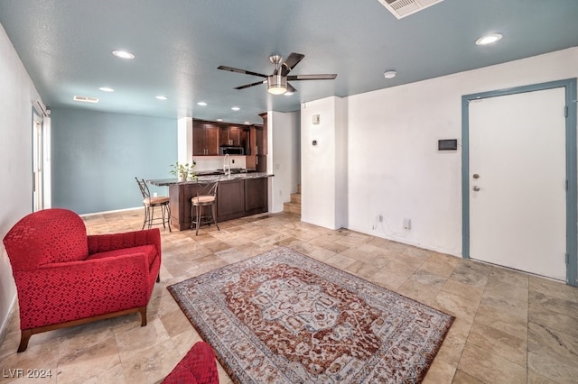 living room with ceiling fan