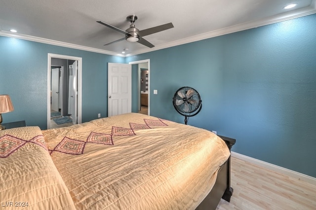 bedroom with crown molding, hardwood / wood-style flooring, and ceiling fan