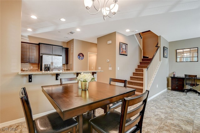 dining room with a chandelier