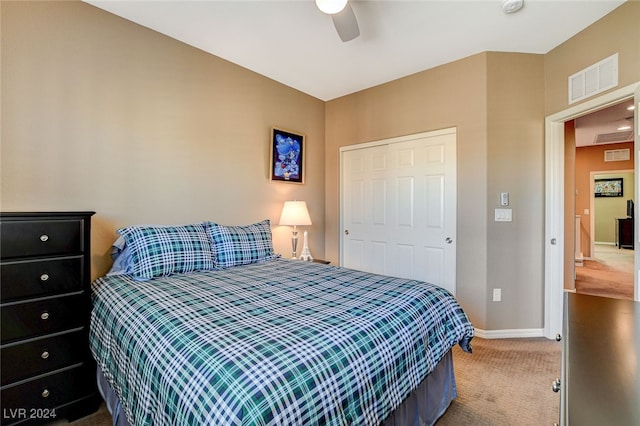 bedroom featuring a closet, ceiling fan, and carpet floors