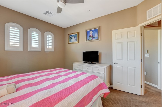 bedroom featuring light colored carpet and ceiling fan