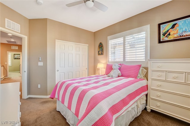 carpeted bedroom with a closet and ceiling fan