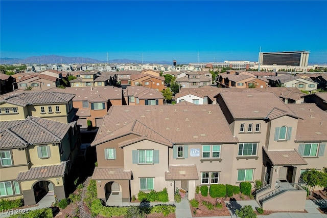 birds eye view of property with a mountain view