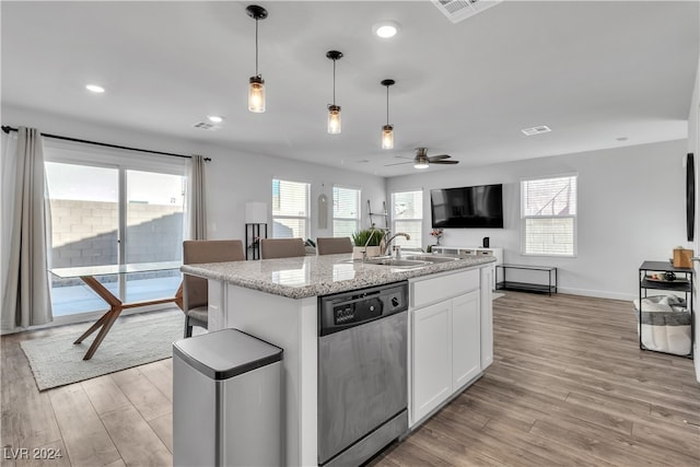 kitchen with white cabinetry, dishwasher, light wood-type flooring, and an island with sink