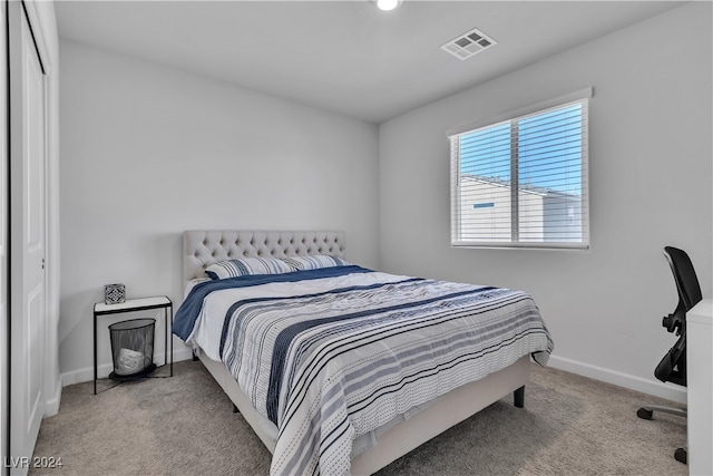 carpeted bedroom with a closet