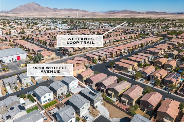 birds eye view of property with a mountain view