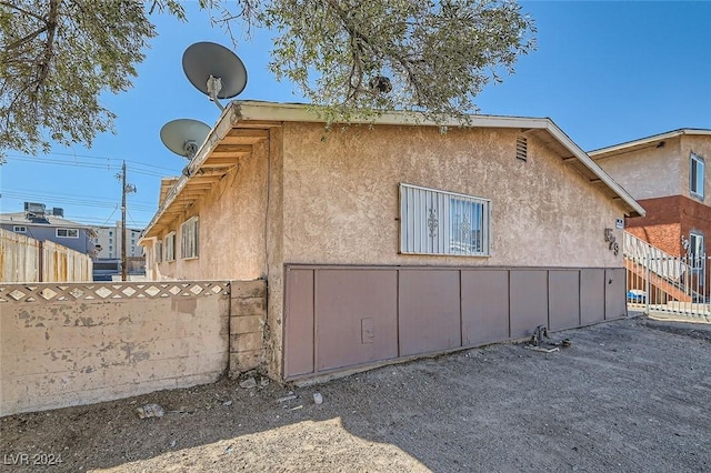529 Mckellar Cir, Las Vegas, NV 89119 - view of home's exterior featuring stucco siding and fence