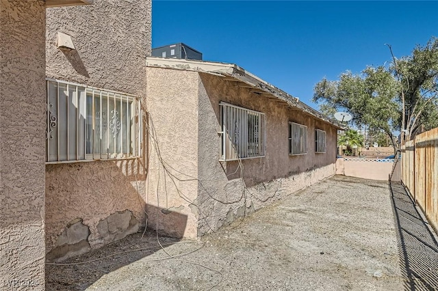 529 Mckellar Cir, Las Vegas, NV 89119 - view of property exterior featuring fence and stucco siding