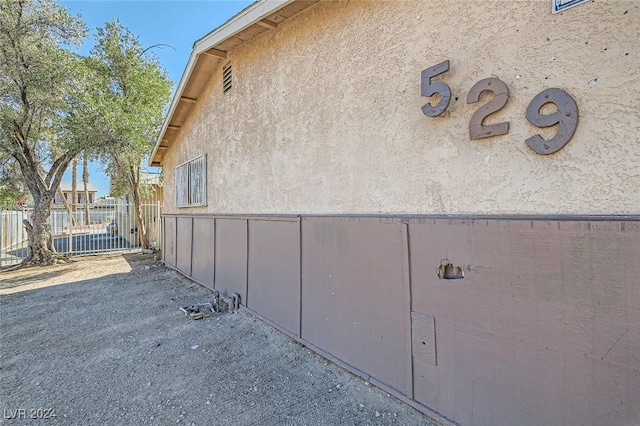 529 Mckellar Cir, Las Vegas, NV 89119 - view of side of home featuring fence and stucco siding