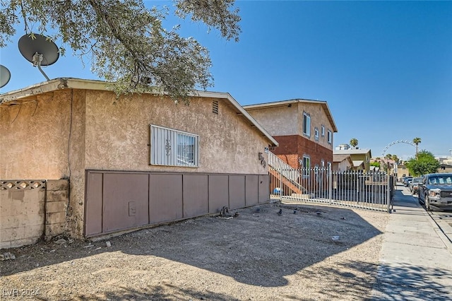 529 Mckellar Cir, Las Vegas, NV 89119 - view of side of property featuring fence and stucco siding