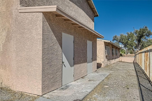 529 Mckellar Cir, Las Vegas, NV 89119 - view of home's exterior featuring a fenced backyard and stucco siding