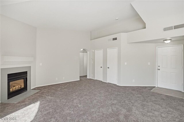4811 Black Bear Rd Unit 201, Las Vegas, NV 89149 - unfurnished living room with carpet floors, a fireplace, and baseboards