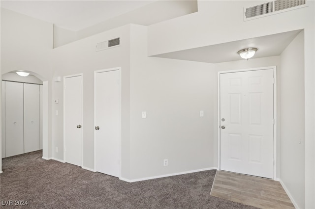 view of carpeted entrance foyer