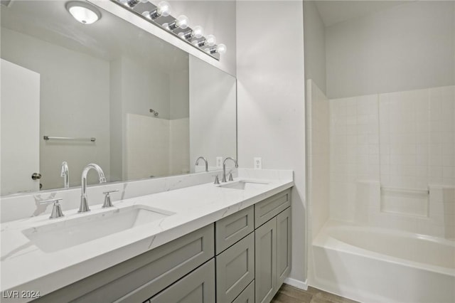 4811 Black Bear Rd Unit 201, Las Vegas, NV 89149 - bathroom featuring double vanity, shower / washtub combination, and wood finished floors