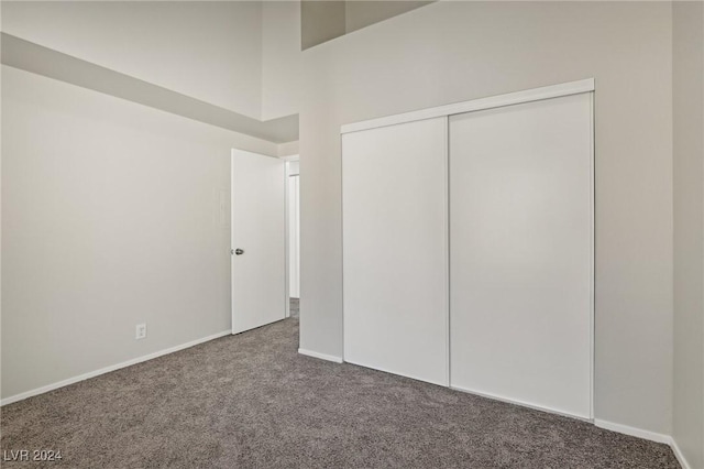 4811 Black Bear Rd Unit 201, Las Vegas, NV 89149 - unfurnished bedroom with carpet flooring, a closet, and baseboards