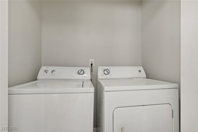 laundry area with washing machine and clothes dryer