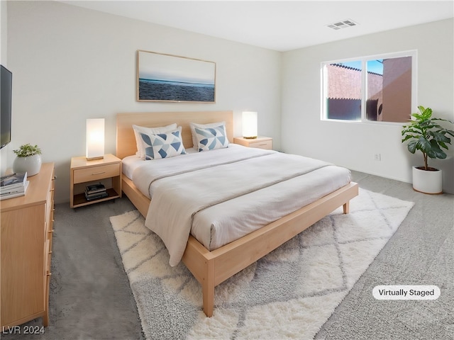 bedroom featuring light colored carpet