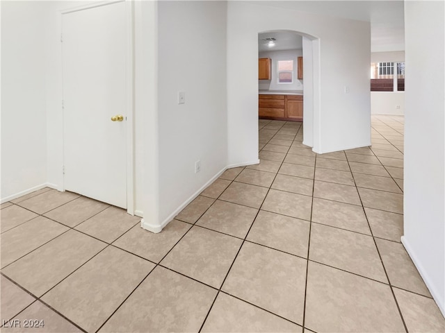 hallway featuring light tile patterned floors