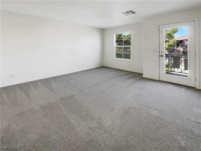 unfurnished room featuring carpet flooring