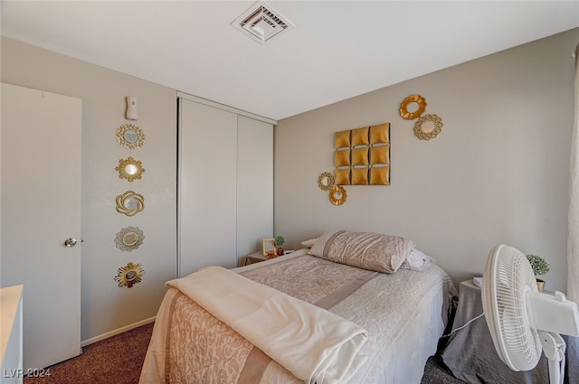 bedroom with a closet and carpet