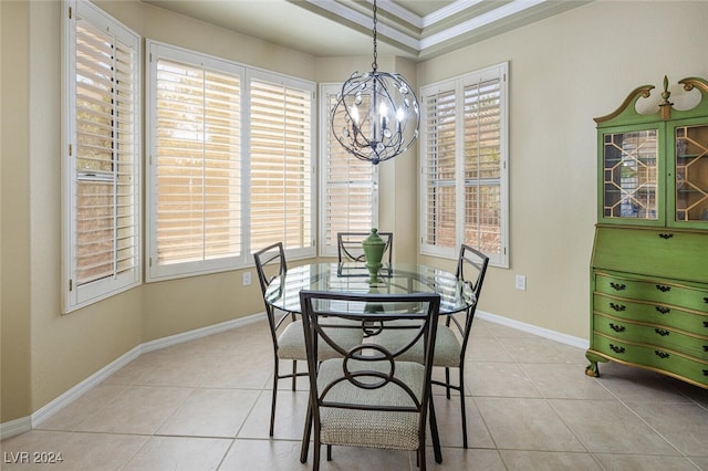 dining area featuring light tile patterned floors, crown molding, and a wealth of natural light