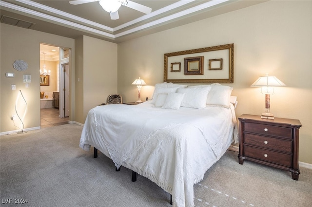 carpeted bedroom featuring ensuite bath, ceiling fan, and crown molding