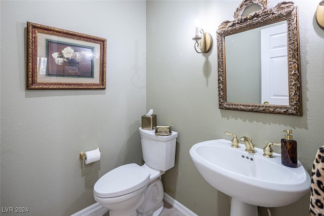 bathroom with toilet and sink