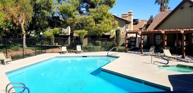 view of swimming pool with a hot tub, a patio area, and central air condition unit