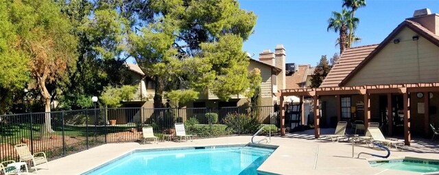 view of swimming pool with a patio