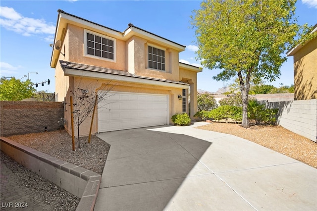 view of front of home with a garage