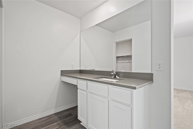 bathroom with vanity and hardwood / wood-style flooring