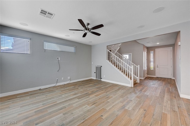 interior space with light hardwood / wood-style flooring and ceiling fan