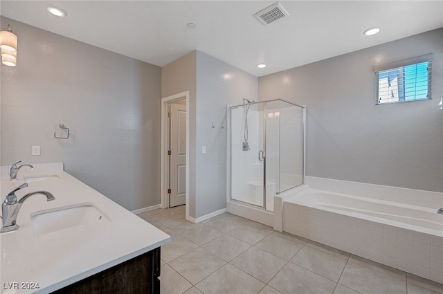 bathroom featuring tile patterned flooring, shower with separate bathtub, and vanity